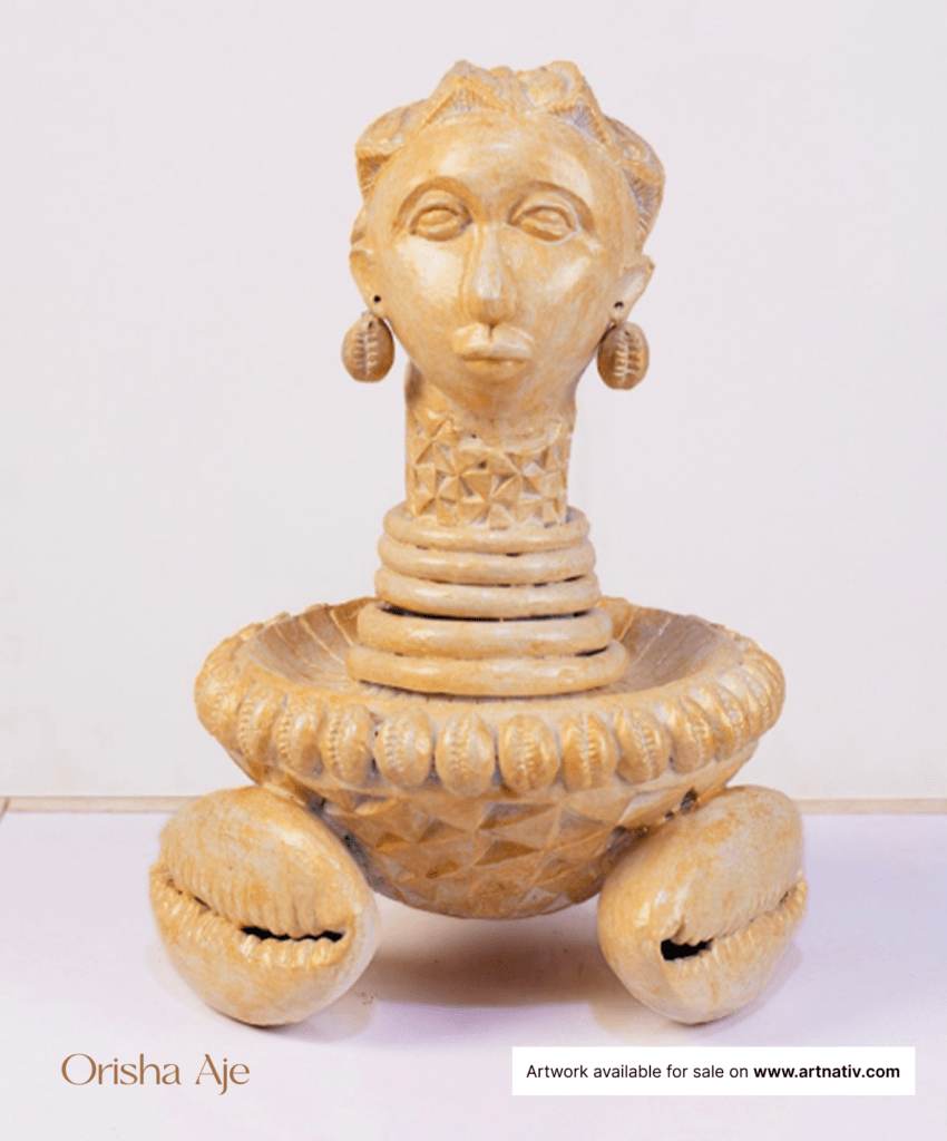 African art sculpture named "Orisha Aje" In Yorùbá mythology, the goddess Aje is portrayed as the patroness of money and success. Suitable for home décor, interior styling, gifting, personal expression, milestone moments, office spaces, cultural appreciation, and building lasting art collections.