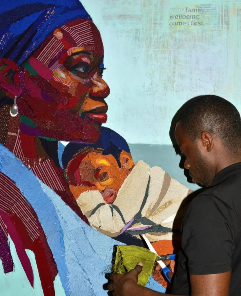 Pelumi Ponmile drawing a cultural artwork in his studio