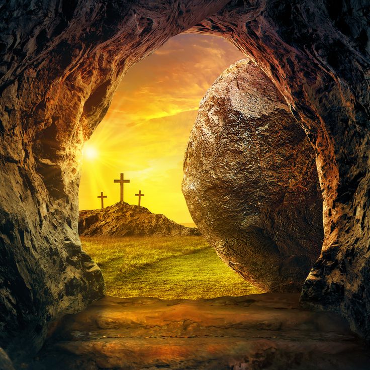 Empty tomb of Jesus Christ on Easter Sunday morning with folded burial linen, large rolled-away stone, and radiant sunrise casting golden light through the cave opening onto three crosses at Calvary — Christian resurrection and hope imagery